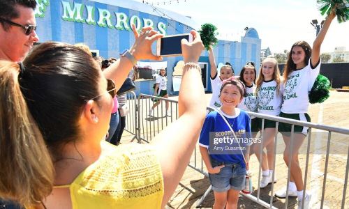 SANTA MONICA, CALIFORNIA - JUNE 29: Fans are greeted by Hawkins High School cheerleaders at the Netflix's "Stranger Things" Season 3 Fun Fair at Santa Monica Pier on June 29, 2019 in Santa Monica, California. (Photo by Amy Sussman/Getty Images)