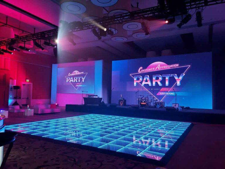 Illuminated LED dance floor installed in front of event screens